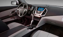A steering wheel and an interior dash view of the 2010 GMC Yukon Terrain